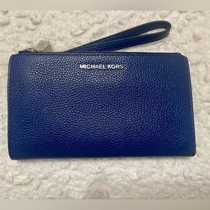 Authentic Michael Kors sapphire blue pebble leather smartphone wristlet wallet